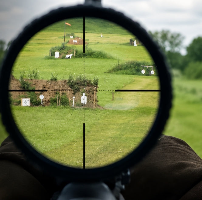 Golf-style rangefinder vs. scope comparison image showing a target view through optics on a green outdoor course.
